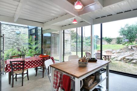 A barn above the ocean.
