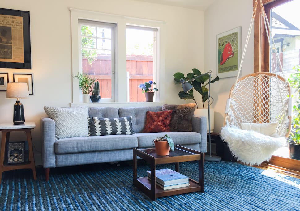 Breezy and bright living room opens up to a private back deck.