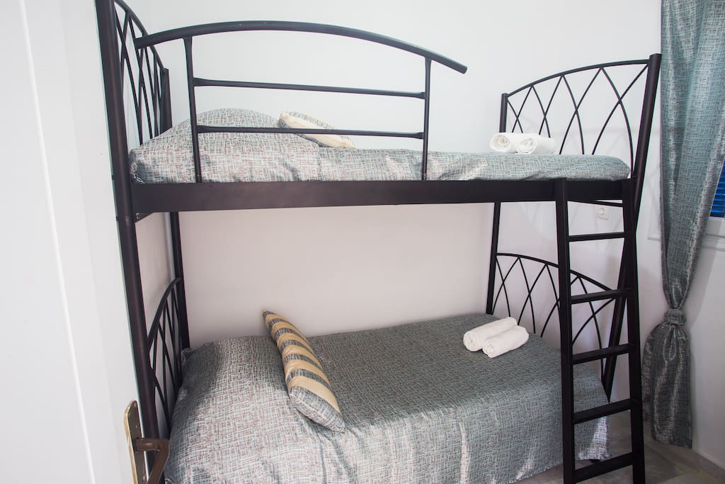 The second bedroom may accommodate two children or two adults. The bunkbed is offered with side safety bars from all three sides.