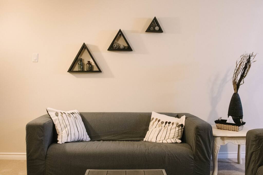 The living room also has ample seating with 2 love seats and a char.
