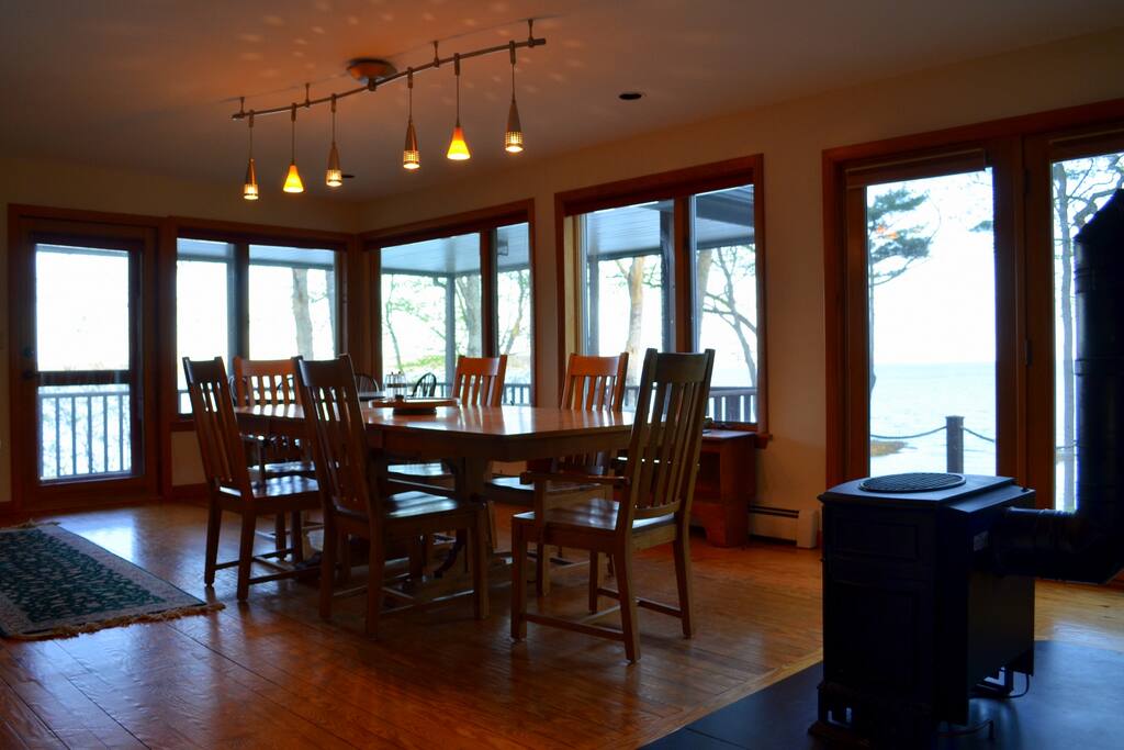 Dining area has a cozy gas fireplace and sweeping ocean views.