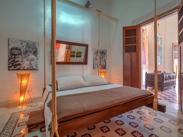 First Bedroom with King Size Hanging Bed, with Pull out side tables, Armour, Air Conditioning and Private (Separate Bathroom)