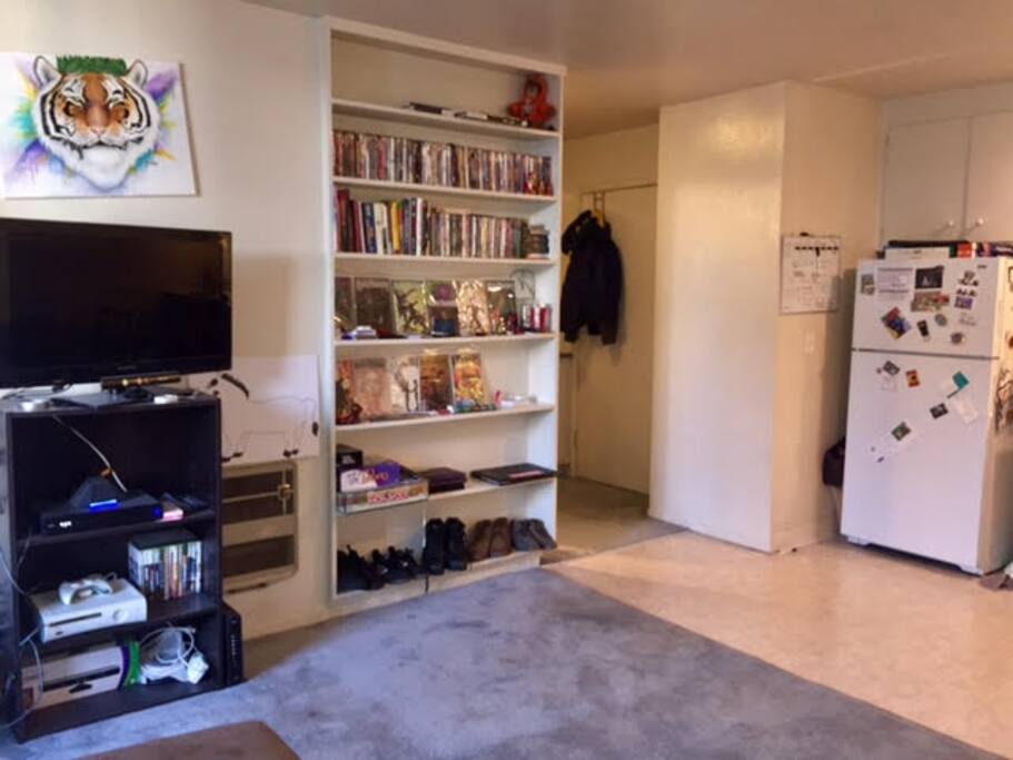 Living room + Kitchen photo facing apartment door.