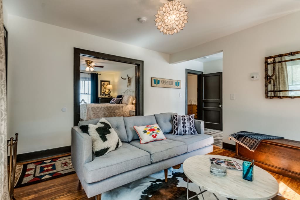~West Elm meets Urban Cowboy with vintage furnishings from all over the country, yet modern elements for your comfort like this West Elm sofa~
