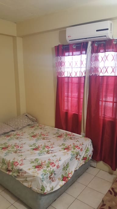 Queen sized bed with AC
