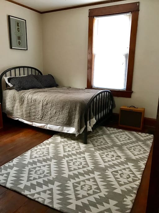 Full Size bed in private bedroom with super think memory foam topper.