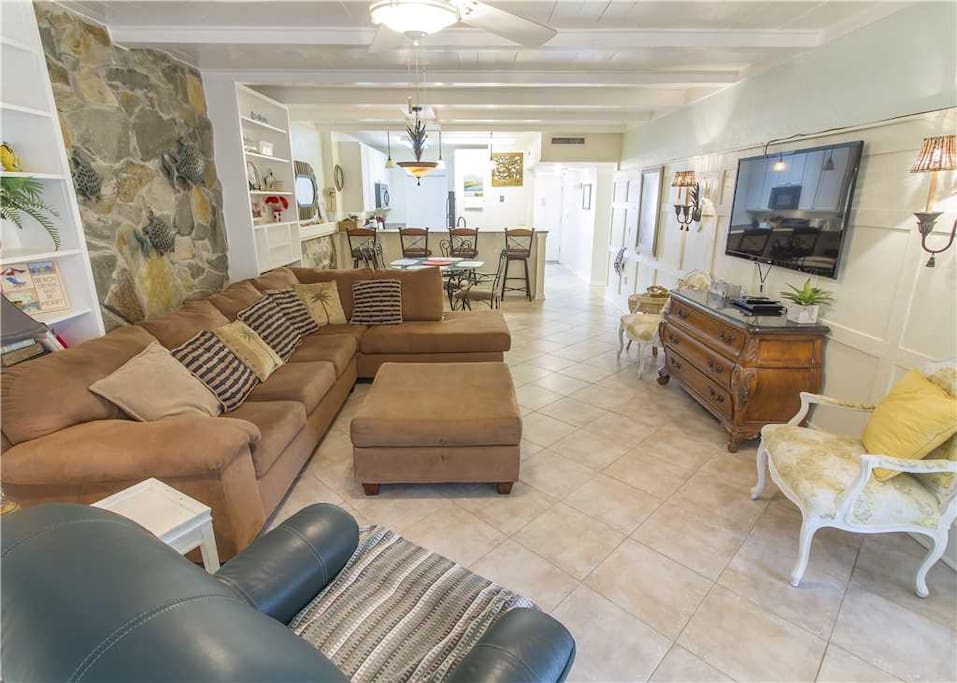 Spacious Living Room - Large comfortable couches, cable HDTV, and ceiling fan so you can enjoy your evenings with family and lots