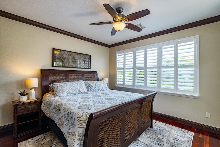 Master bedroom with comfortable king bed on third floor with private balcony and master bathroom.