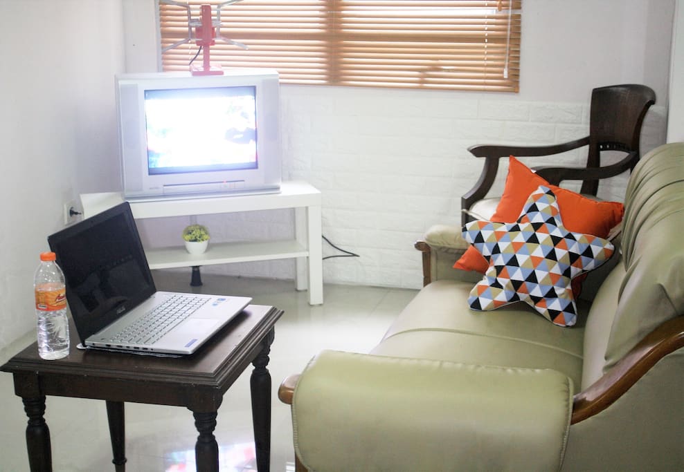 you can use the side table and turn it into your comfortable working spot while watching tv