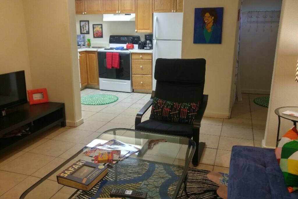 A view into the spacious and well-equipped kitchen from the living room. There's a dishwasher in the kitchen, as well as a washer and dryer!