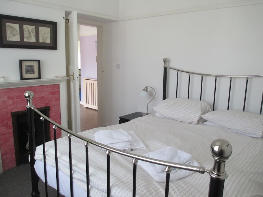 Main bedroom, king size bed, original feature fireplace