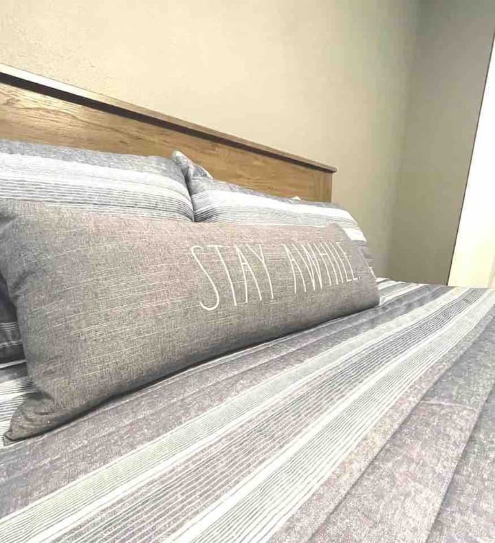 Brand new king size bed with new bedding and plush pillows! 