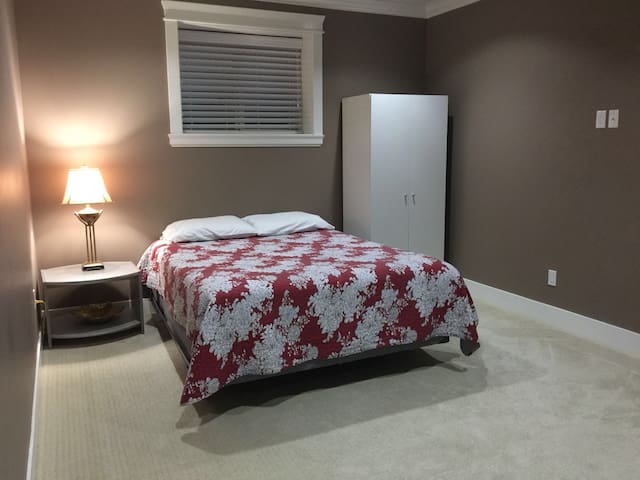 Basement queen size bed with private bathroom