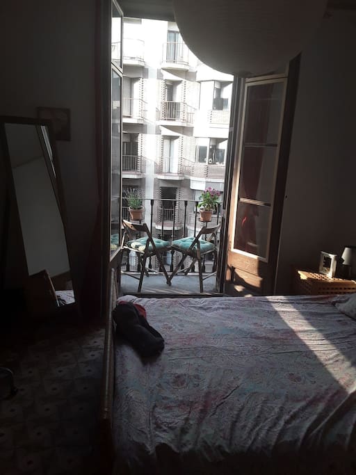 main bedroom with small balcony