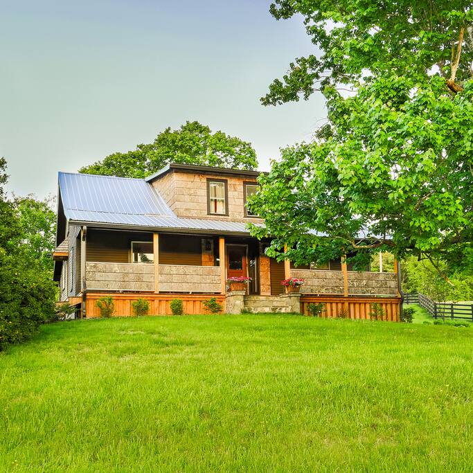 The Guest House presides over an expansive spread of rolling hills at the foot of the Tennessee mountains.