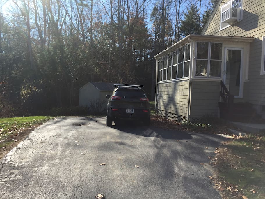 Guest parking in the driveway to the left.