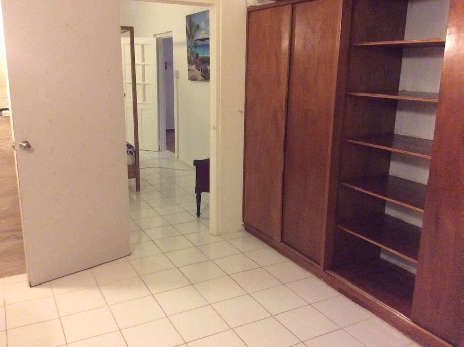 View from the bathroom into the bedroom and build in closet.