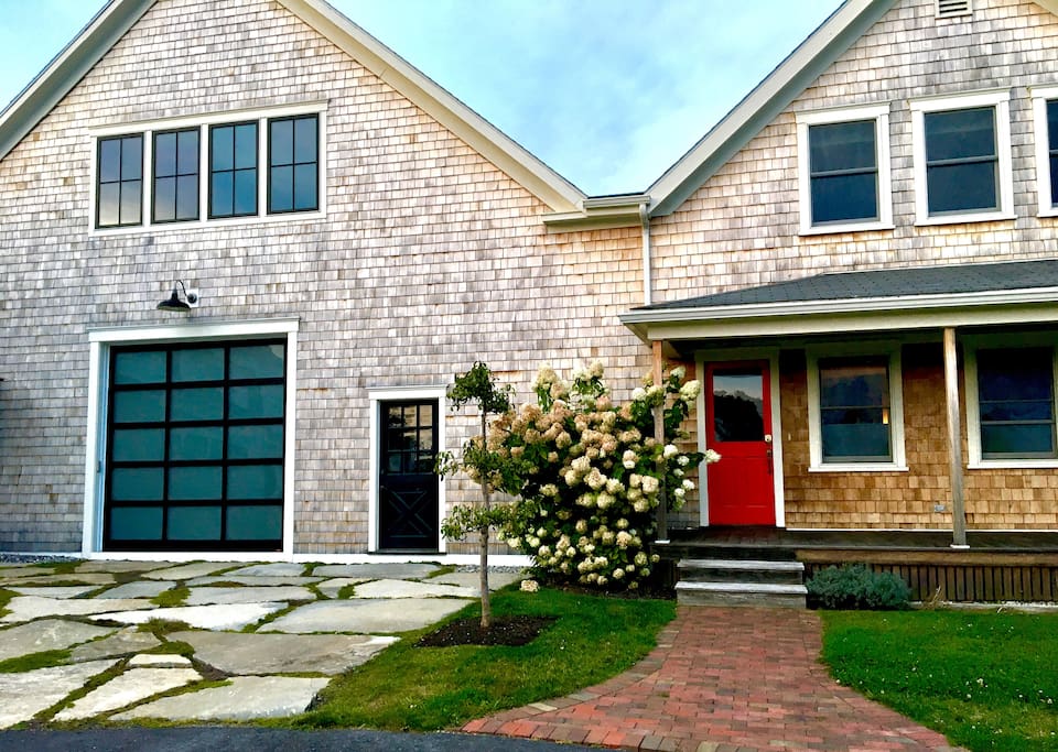 Follow the stairs behind the red door to the tranquil, light-filled Loft at Kettle Cove Farm.
