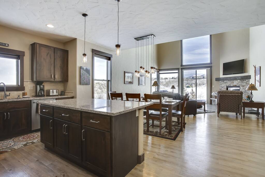 Open floor plan with custom wood flooring.