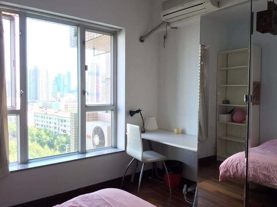 The room C you'll be living in with a double bed, a desk, a wardrobe and nice view