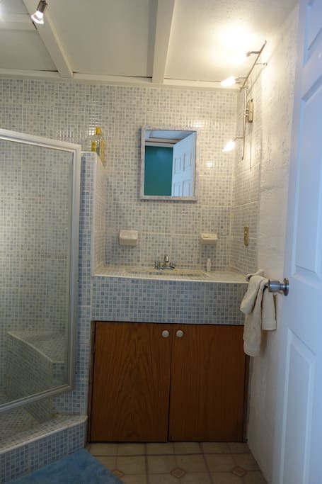 Beautifully remodeled tile bathroom with hot water