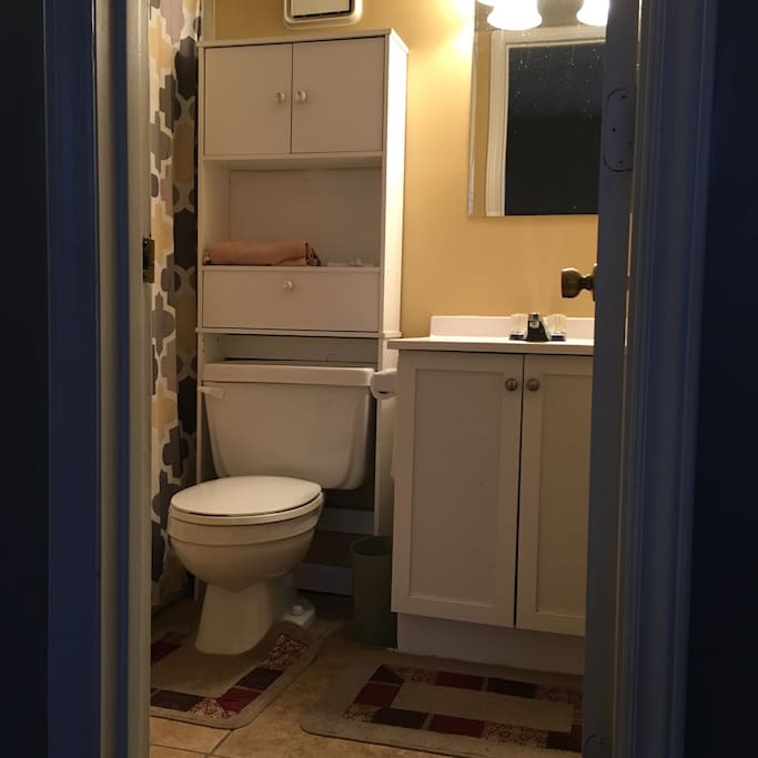 Nice Full Bathroom with tiled floor and great shower head.