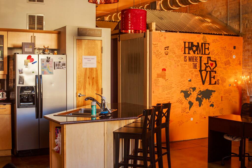 A great pic that shows of our our kitchen, signing wall, and a portion of our Co-Working area that has 15+ workspaces!