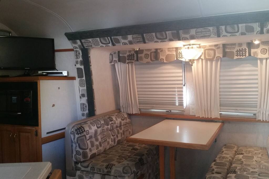 Dining room table can break down to a bed to sleep 2