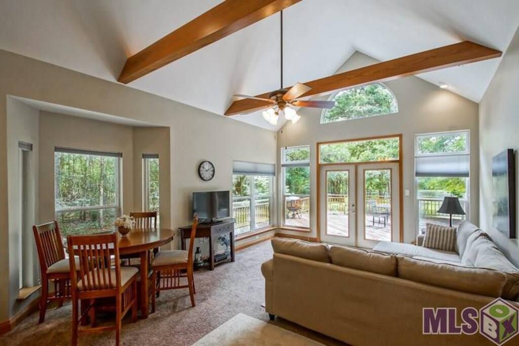 Lots of windows to enjoy the beautiful view of private pond from living room