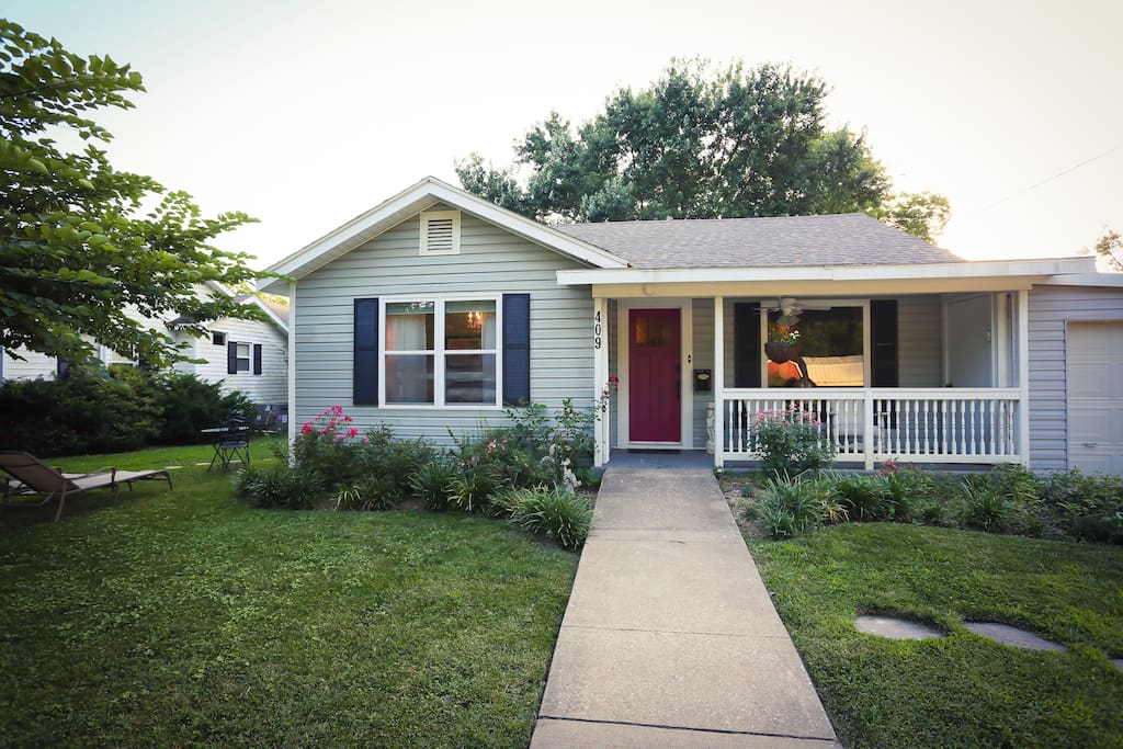 Room is located to the left of house down stone path through privacy fence gate.