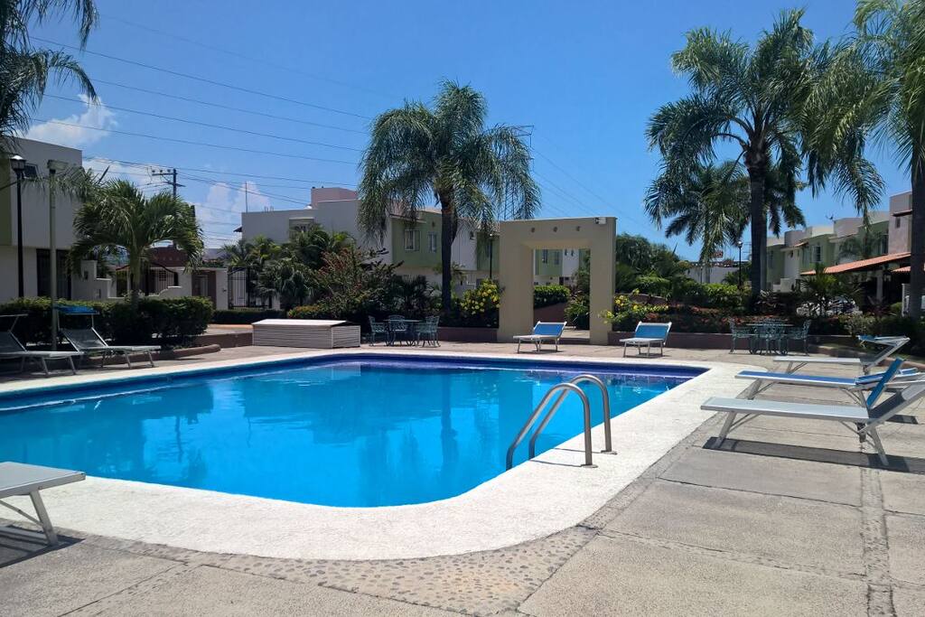 Condo pool with leisure adjacent zone.