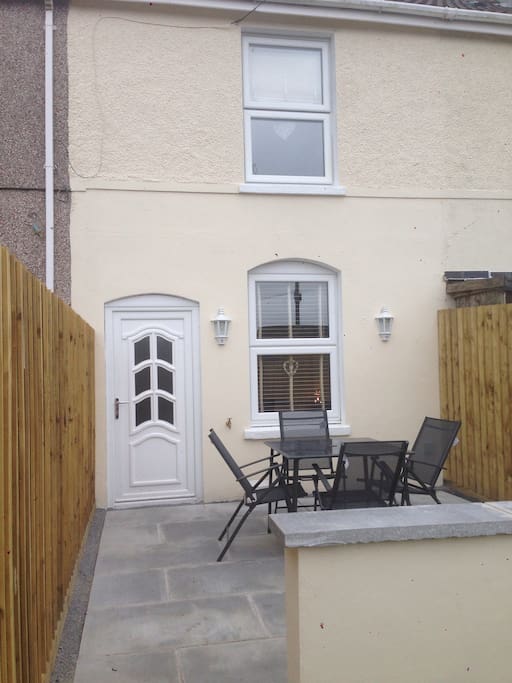 Front of house with private patio area