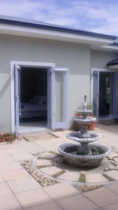 French doors opens into courtyard