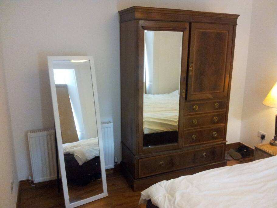 This is the main bedroom that sleeps 3.....It has lovely wooden floors and lot's of mirrors for making sure you look great!
