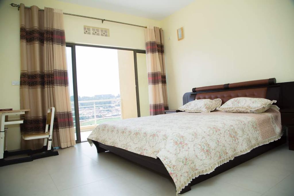 Master bedroom with access to the private balcony and a bed with a very soft mattress
