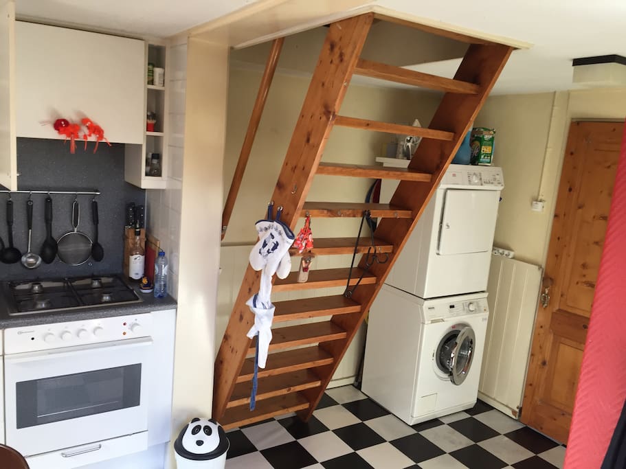 Stairs to the bedrooms and washingmachine & dryer