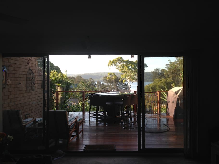 Outdoor veranda with 8 seater table that has an ice bucket in the middle and also an ice maker. Great for a relaxing afternoon.