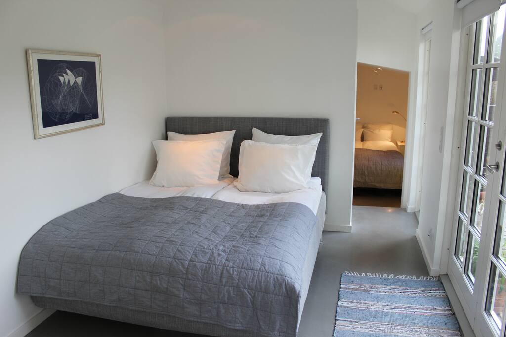 The main bedroom and view to a smaller bedroom