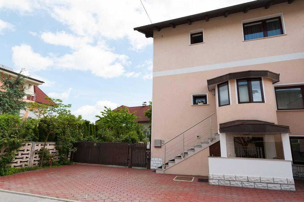 House where apartment is located (white facade)