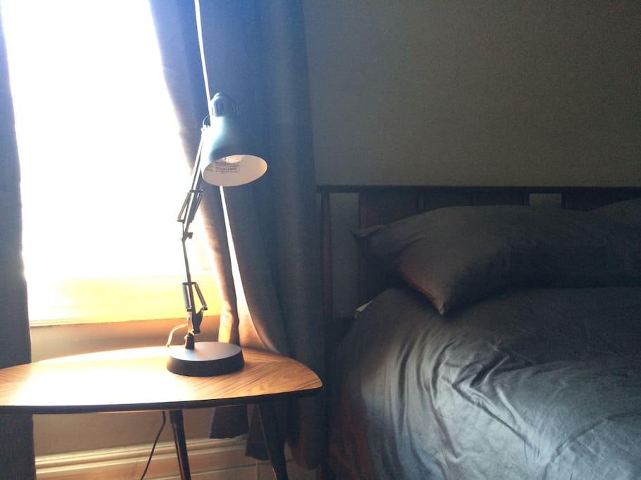 Full-size bed with sheets and cool summer comforter. Firm and soft pillows are provided.