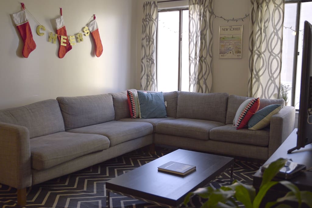 Our living room seats guests comfortably, where you can watch television or Netflix (we hope you're here to enjoy what the city offers though!)