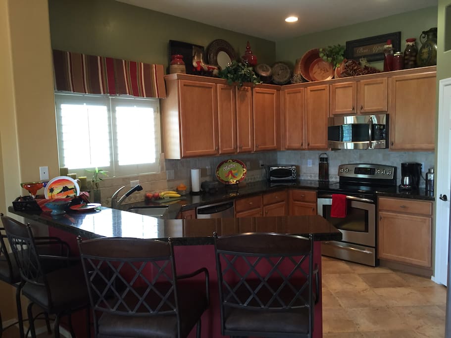 Great kitchen with granite counter tops and stainless appliances