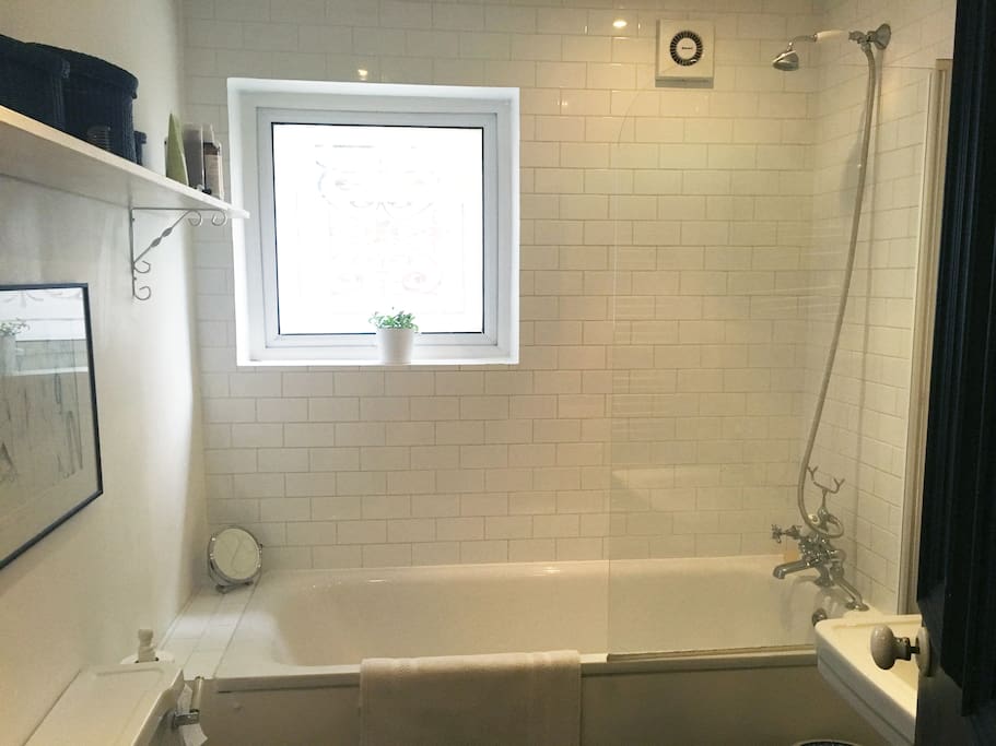 Simple white bath, shower and sink