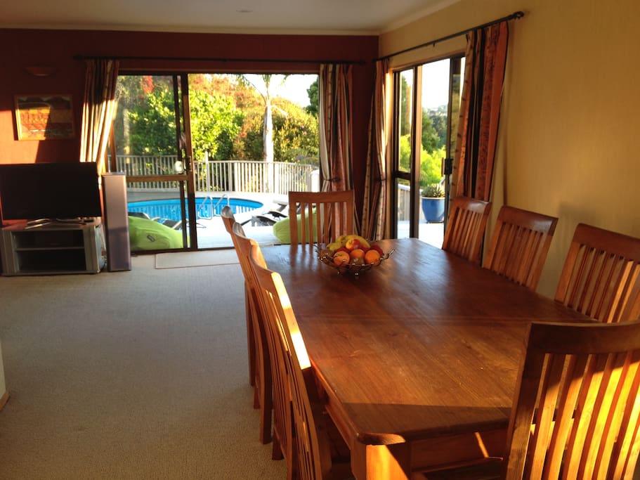 open plan dining and lounge area opening out to pool and bbq area