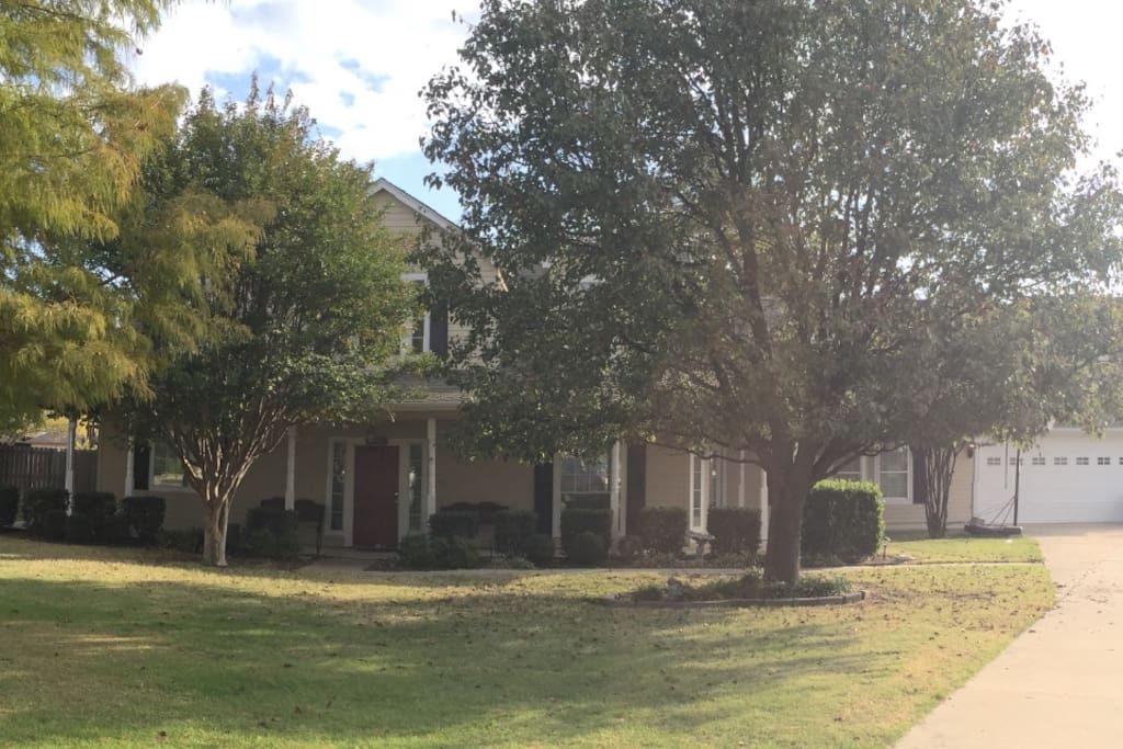 Street view from cul-de-sac of the beautiful house on 3/4 acre lot.