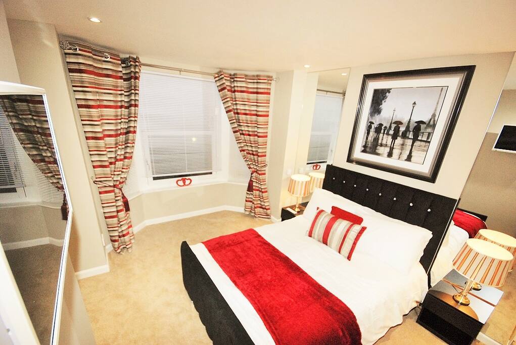 Master bedroom; built in wardrobes, double bed, tv/dvd on wall which is connected to the freesat box in lounge.