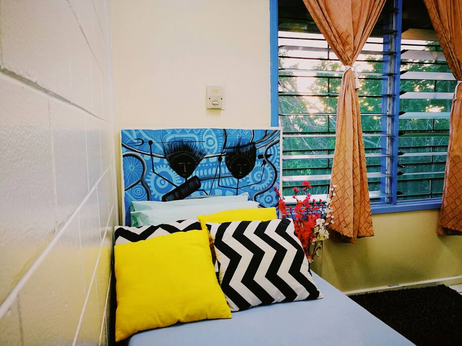 One side of the bed. Please note that the bedding and the pillows are changed every now and then.