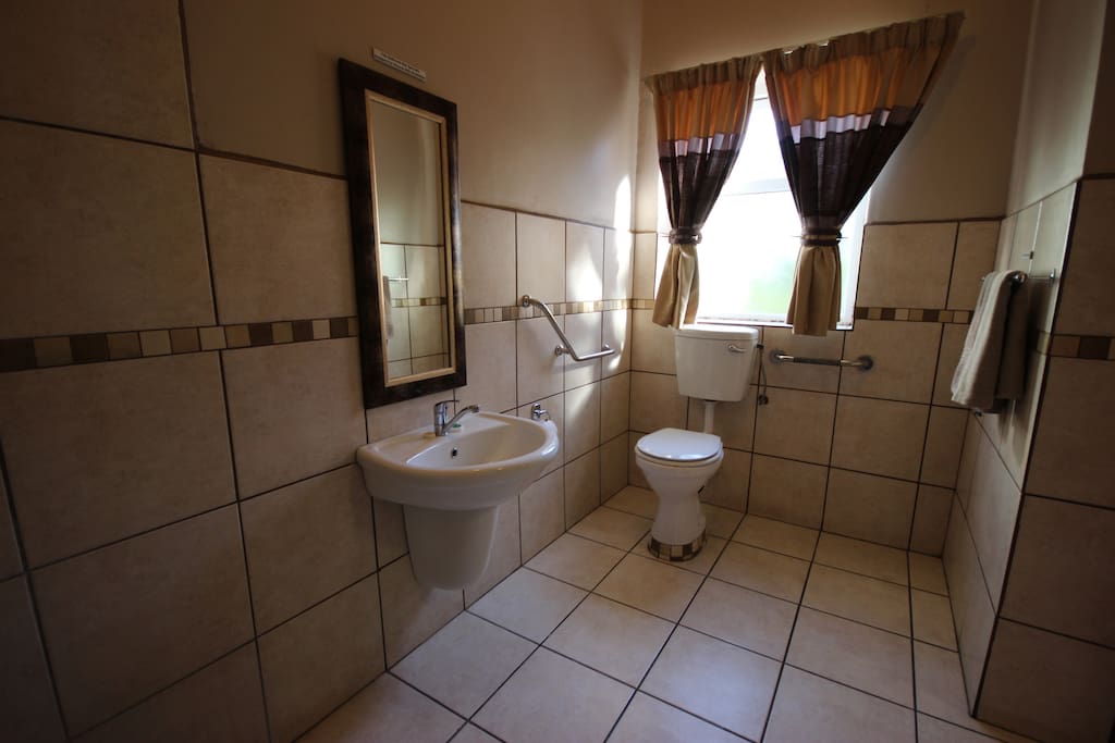 Toilet specially designed for handicapped guests. Front and side transfers.