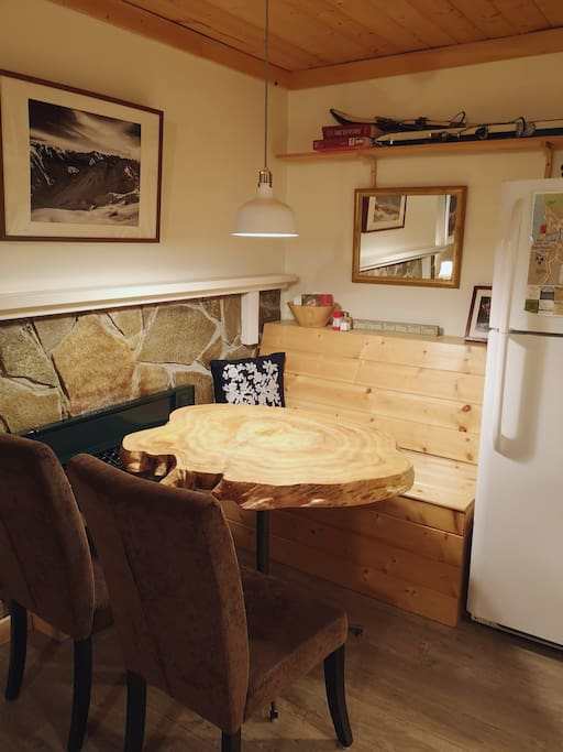 Live edge wood table, napkins, salt and pepper, and great place to enjoy a meal.
