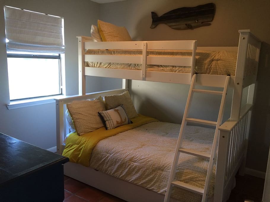 2nd bedroom with twin over full bunkbeds and pull-out twin trundle below.